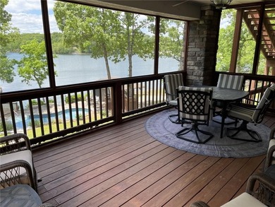 Experience resort-style living with this exceptional lakefront on Bella Vista Country Club - Berksdale in Arkansas - for sale on GolfHomes.com, golf home, golf lot