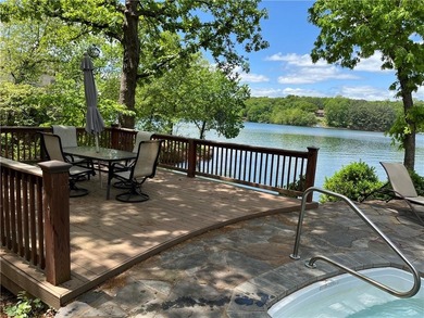 Experience resort-style living with this exceptional lakefront on Bella Vista Country Club - Berksdale in Arkansas - for sale on GolfHomes.com, golf home, golf lot