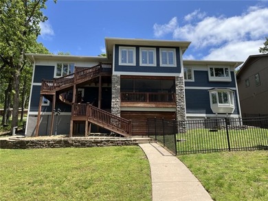 Experience resort-style living with this exceptional lakefront on Bella Vista Country Club - Berksdale in Arkansas - for sale on GolfHomes.com, golf home, golf lot