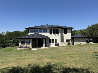 Stylish Hill Country contemporary home backing up to the #1 tee on Apple Rock Golf Course - Horseshoe Bay in Texas - for sale on GolfHomes.com, golf home, golf lot