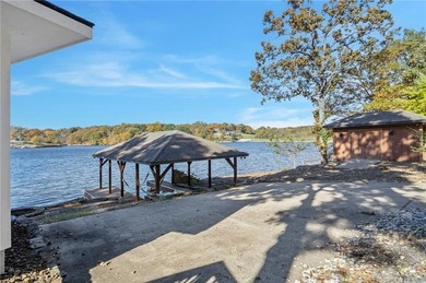 Experience resort-style living with this exceptional lakefront on Bella Vista Country Club - Berksdale in Arkansas - for sale on GolfHomes.com, golf home, golf lot