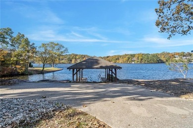Experience resort-style living with this exceptional lakefront on Bella Vista Country Club - Berksdale in Arkansas - for sale on GolfHomes.com, golf home, golf lot