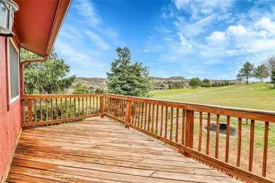 SITTING ON THE GOLF COURSE with both **mountain and city views** on Red Rocks Country Club in Colorado - for sale on GolfHomes.com, golf home, golf lot