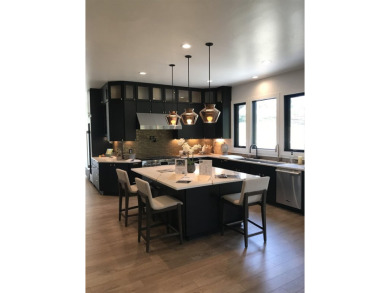 Stylish Hill Country contemporary home backing up to the #1 tee on Apple Rock Golf Course - Horseshoe Bay in Texas - for sale on GolfHomes.com, golf home, golf lot