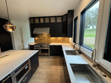 Stylish Hill Country contemporary home backing up to the #1 tee on Apple Rock Golf Course - Horseshoe Bay in Texas - for sale on GolfHomes.com, golf home, golf lot