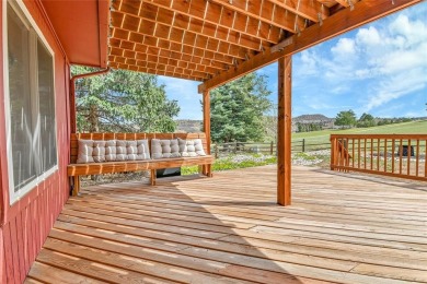 SITTING ON THE GOLF COURSE with both **mountain and city views** on Red Rocks Country Club in Colorado - for sale on GolfHomes.com, golf home, golf lot