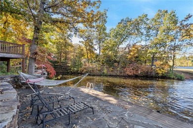 Experience resort-style living with this exceptional lakefront on Bella Vista Country Club - Berksdale in Arkansas - for sale on GolfHomes.com, golf home, golf lot