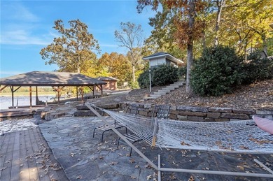 Experience resort-style living with this exceptional lakefront on Bella Vista Country Club - Berksdale in Arkansas - for sale on GolfHomes.com, golf home, golf lot