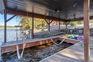 Experience resort-style living with this exceptional lakefront on Bella Vista Country Club - Berksdale in Arkansas - for sale on GolfHomes.com, golf home, golf lot