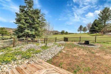 SITTING ON THE GOLF COURSE with both **mountain and city views** on Red Rocks Country Club in Colorado - for sale on GolfHomes.com, golf home, golf lot