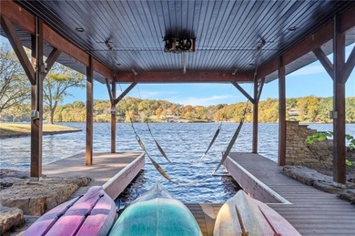 Experience resort-style living with this exceptional lakefront on Bella Vista Country Club - Berksdale in Arkansas - for sale on GolfHomes.com, golf home, golf lot