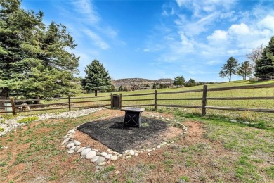 SITTING ON THE GOLF COURSE with both **mountain and city views** on Red Rocks Country Club in Colorado - for sale on GolfHomes.com, golf home, golf lot