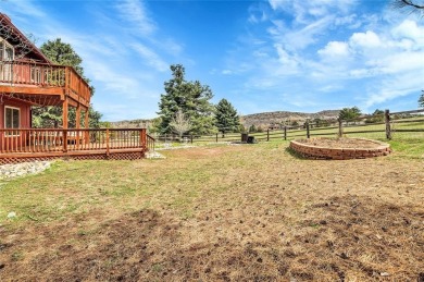 SITTING ON THE GOLF COURSE with both **mountain and city views** on Red Rocks Country Club in Colorado - for sale on GolfHomes.com, golf home, golf lot