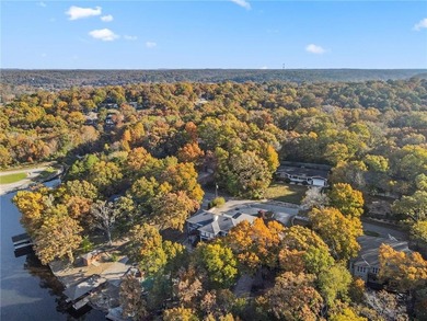Experience resort-style living with this exceptional lakefront on Bella Vista Country Club - Berksdale in Arkansas - for sale on GolfHomes.com, golf home, golf lot