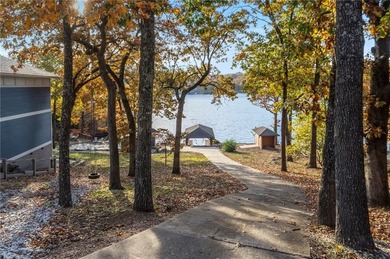 Experience resort-style living with this exceptional lakefront on Bella Vista Country Club - Berksdale in Arkansas - for sale on GolfHomes.com, golf home, golf lot