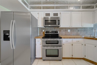 Welcome to this spacious 2-bedroom, 2-bathroom condo offering 1 on East Bay Golf Club in Florida - for sale on GolfHomes.com, golf home, golf lot