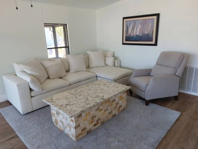 Beautifully updated center cul-de-sac partially furnished home on Lake Fairways Country Club in Florida - for sale on GolfHomes.com, golf home, golf lot