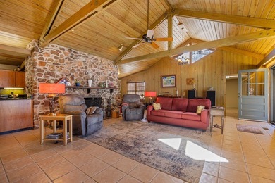 Discover this beautifully preserved mid-century lake house on Francis Lake Golf Club in Georgia - for sale on GolfHomes.com, golf home, golf lot