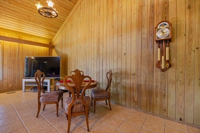 Discover this beautifully preserved mid-century lake house on Francis Lake Golf Club in Georgia - for sale on GolfHomes.com, golf home, golf lot