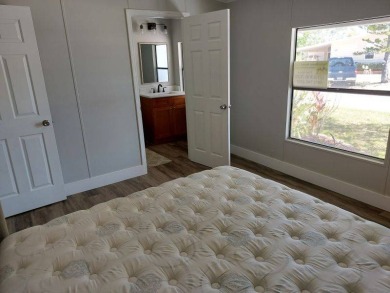 Beautifully updated center cul-de-sac partially furnished home on Lake Fairways Country Club in Florida - for sale on GolfHomes.com, golf home, golf lot