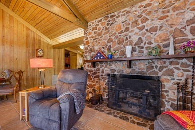 Discover this beautifully preserved mid-century lake house on Francis Lake Golf Club in Georgia - for sale on GolfHomes.com, golf home, golf lot