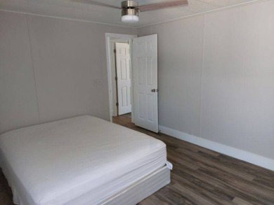 Beautifully updated center cul-de-sac partially furnished home on Lake Fairways Country Club in Florida - for sale on GolfHomes.com, golf home, golf lot