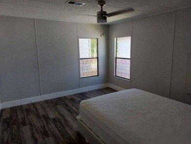 Beautifully updated center cul-de-sac partially furnished home on Lake Fairways Country Club in Florida - for sale on GolfHomes.com, golf home, golf lot