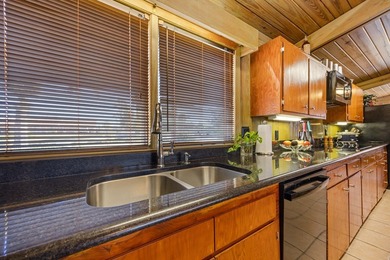 Discover this beautifully preserved mid-century lake house on Francis Lake Golf Club in Georgia - for sale on GolfHomes.com, golf home, golf lot