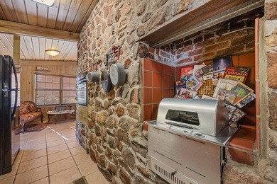 Discover this beautifully preserved mid-century lake house on Francis Lake Golf Club in Georgia - for sale on GolfHomes.com, golf home, golf lot