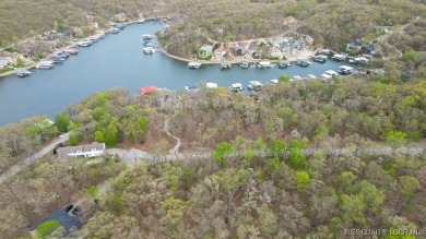 Seize the opportunity to build your dream lakeside retreat on on The Club At Porto Cima in Missouri - for sale on GolfHomes.com, golf home, golf lot