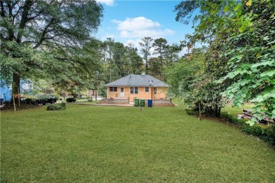 Step into this delightful home brimming with character and ready on Alfred Tup Holmes Golf Course in Georgia - for sale on GolfHomes.com, golf home, golf lot