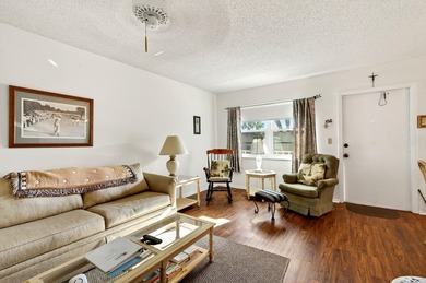 Welcome to effortless Florida living in this beautifully on The American Golf Club in Florida - for sale on GolfHomes.com, golf home, golf lot