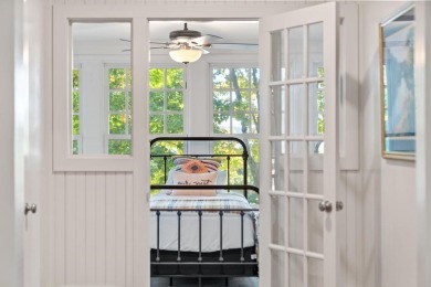 Built on a spacious scenic lot on the north side of Downtown on Charlevoix Golf Club in Michigan - for sale on GolfHomes.com, golf home, golf lot