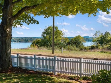 Built on a spacious scenic lot on the north side of Downtown on Charlevoix Golf Club in Michigan - for sale on GolfHomes.com, golf home, golf lot