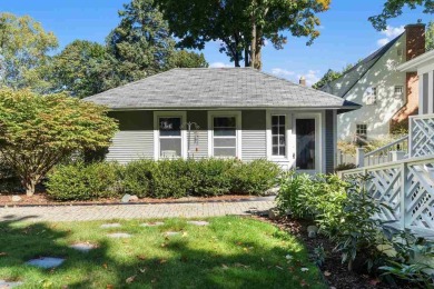 Built on a spacious scenic lot on the north side of Downtown on Charlevoix Golf Club in Michigan - for sale on GolfHomes.com, golf home, golf lot