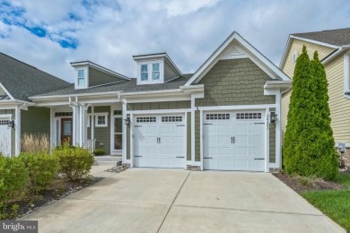 Beautiful Bayside Carriage home overlooking pond with screened on Bayside Resort Golf Club in Delaware - for sale on GolfHomes.com, golf home, golf lot