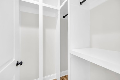 Discover the epitome of lakeside living at 301 Portland Circle on The Links At Stoney Point in South Carolina - for sale on GolfHomes.com, golf home, golf lot