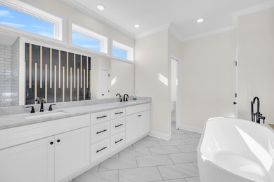 Discover the epitome of lakeside living at 301 Portland Circle on The Links At Stoney Point in South Carolina - for sale on GolfHomes.com, golf home, golf lot