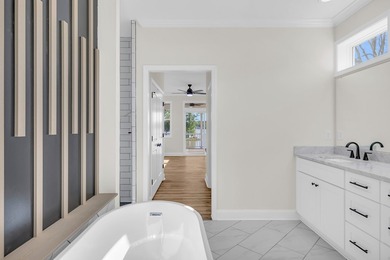 Discover the epitome of lakeside living at 301 Portland Circle on The Links At Stoney Point in South Carolina - for sale on GolfHomes.com, golf home, golf lot