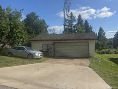 Welcome to this affordable 4-bedroom, 1-bath home situated on a on Crystal View Municipal Golf Course in Michigan - for sale on GolfHomes.com, golf home, golf lot