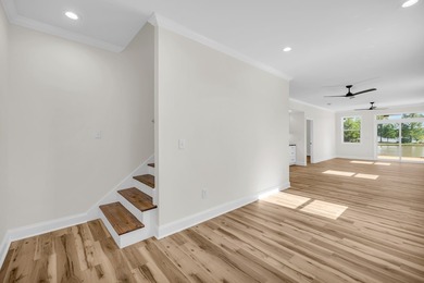 Discover the epitome of lakeside living at 301 Portland Circle on The Links At Stoney Point in South Carolina - for sale on GolfHomes.com, golf home, golf lot