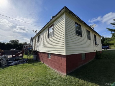 Welcome to this affordable 4-bedroom, 1-bath home situated on a on Crystal View Municipal Golf Course in Michigan - for sale on GolfHomes.com, golf home, golf lot