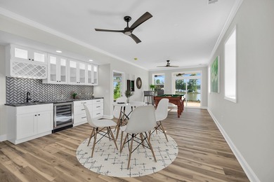 Discover the epitome of lakeside living at 301 Portland Circle on The Links At Stoney Point in South Carolina - for sale on GolfHomes.com, golf home, golf lot