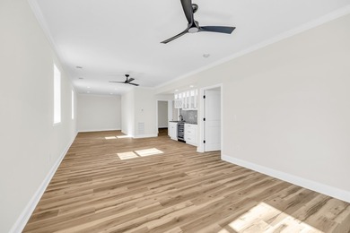 Discover the epitome of lakeside living at 301 Portland Circle on The Links At Stoney Point in South Carolina - for sale on GolfHomes.com, golf home, golf lot