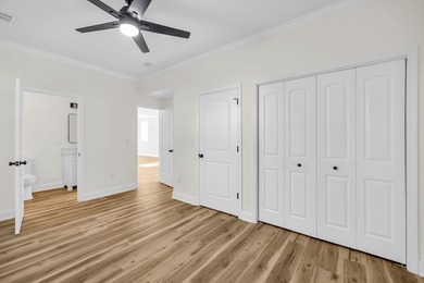 Discover the epitome of lakeside living at 301 Portland Circle on The Links At Stoney Point in South Carolina - for sale on GolfHomes.com, golf home, golf lot