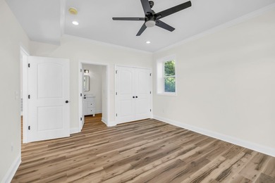 Discover the epitome of lakeside living at 301 Portland Circle on The Links At Stoney Point in South Carolina - for sale on GolfHomes.com, golf home, golf lot