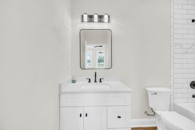 Discover the epitome of lakeside living at 301 Portland Circle on The Links At Stoney Point in South Carolina - for sale on GolfHomes.com, golf home, golf lot