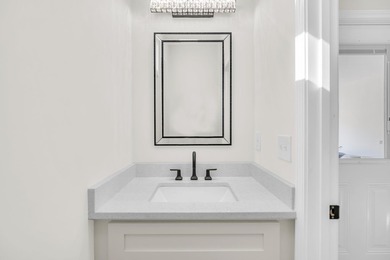 Discover the epitome of lakeside living at 301 Portland Circle on The Links At Stoney Point in South Carolina - for sale on GolfHomes.com, golf home, golf lot