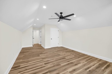 Discover the epitome of lakeside living at 301 Portland Circle on The Links At Stoney Point in South Carolina - for sale on GolfHomes.com, golf home, golf lot