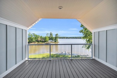 Discover the epitome of lakeside living at 301 Portland Circle on The Links At Stoney Point in South Carolina - for sale on GolfHomes.com, golf home, golf lot